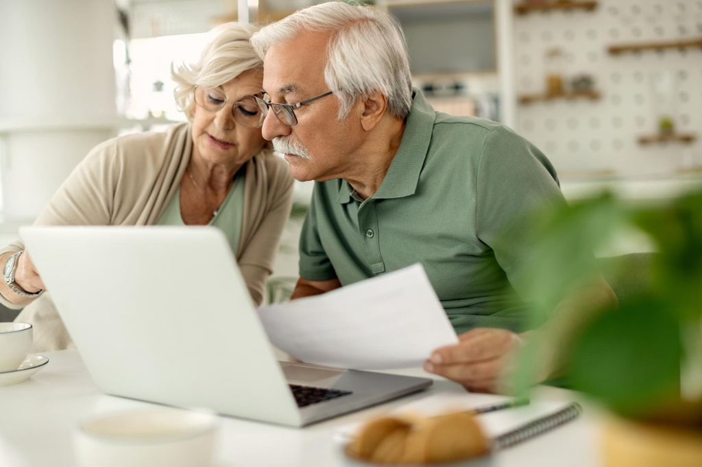 senior-couple-analyzing-their-savings-while-going-through-home-finances (1).jpg