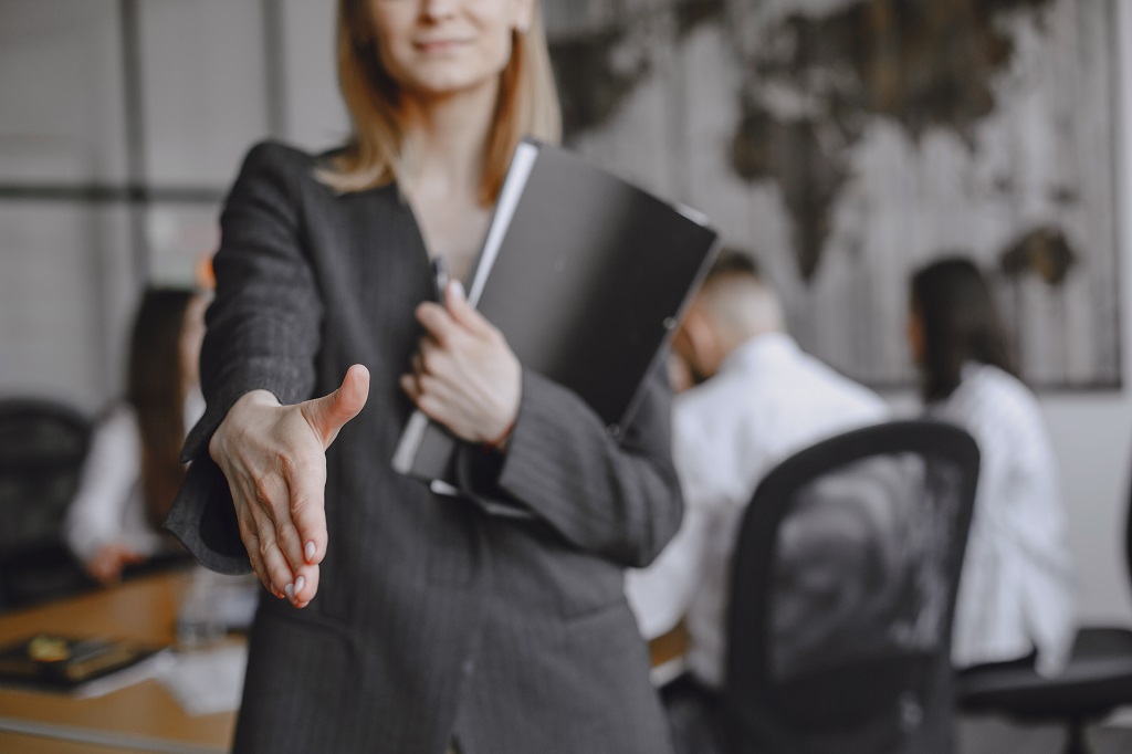 girl-signs-documents-lady-sitting-table-manager-working-office.jpg