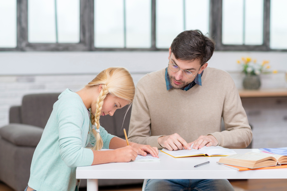 student-and-teacher-looking-at-the-books.jpg