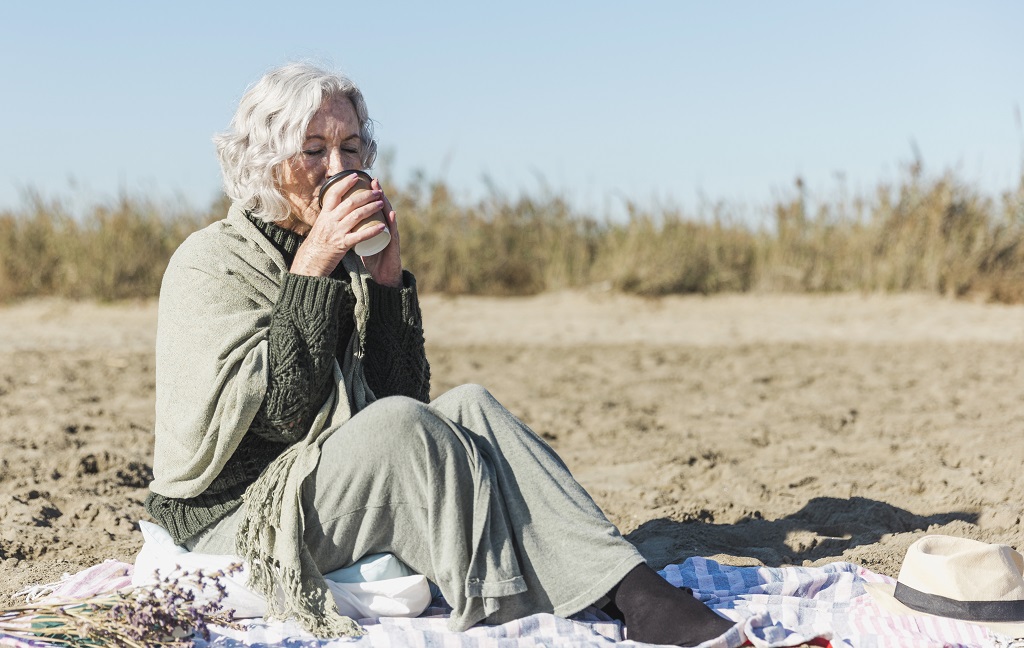 senior-woman-drinking-coffee-outdoors.jpg