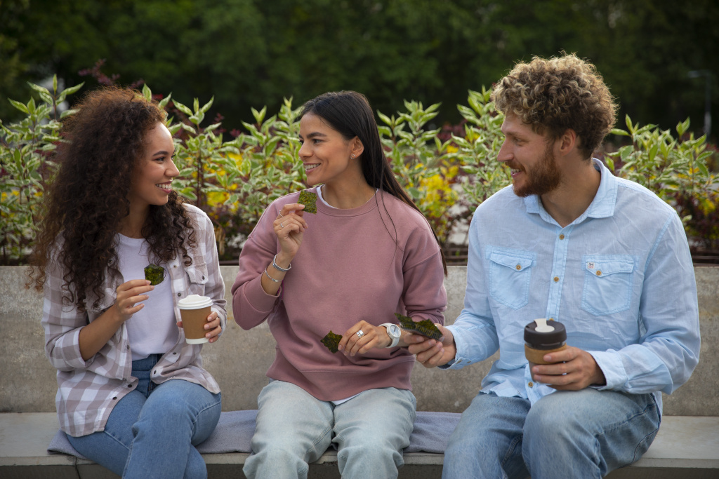 medium-shot-friends-eating-seaweed-snacks.jpg