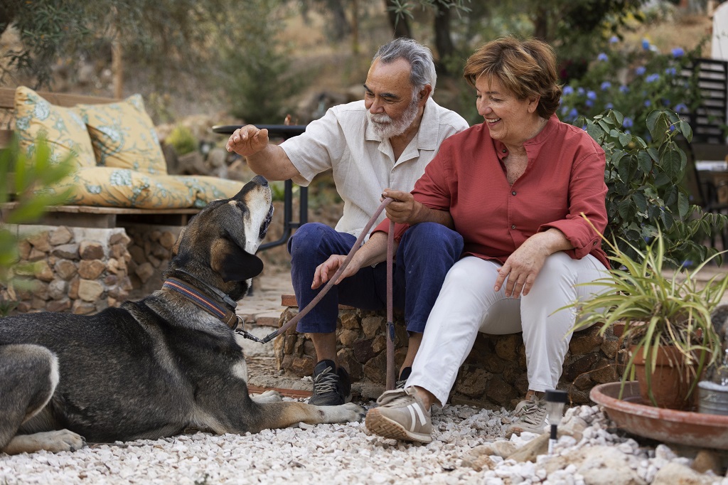 elderly-couple-enjoying-life-at-home-in-the-countryside-with-their-dog.jpg
